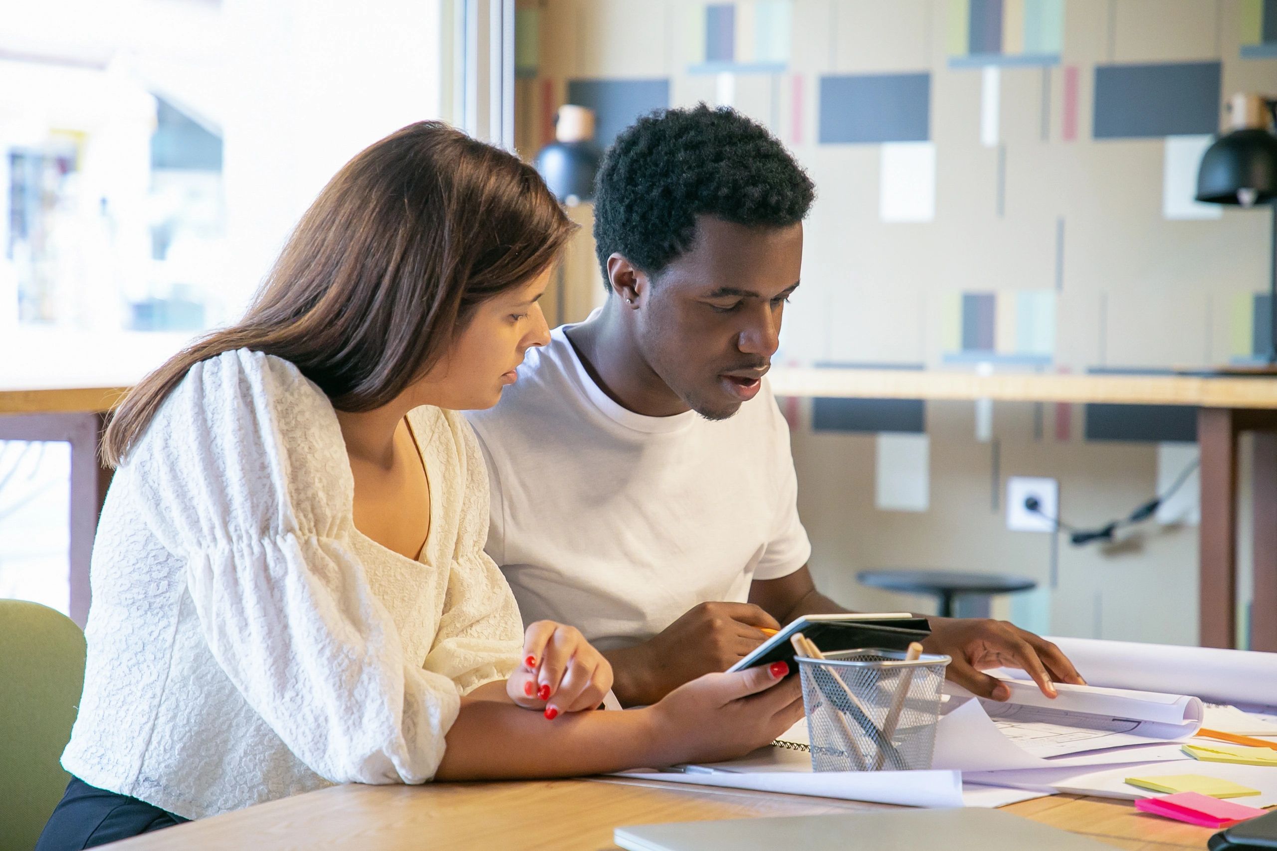 Students reviewing financial planning documents