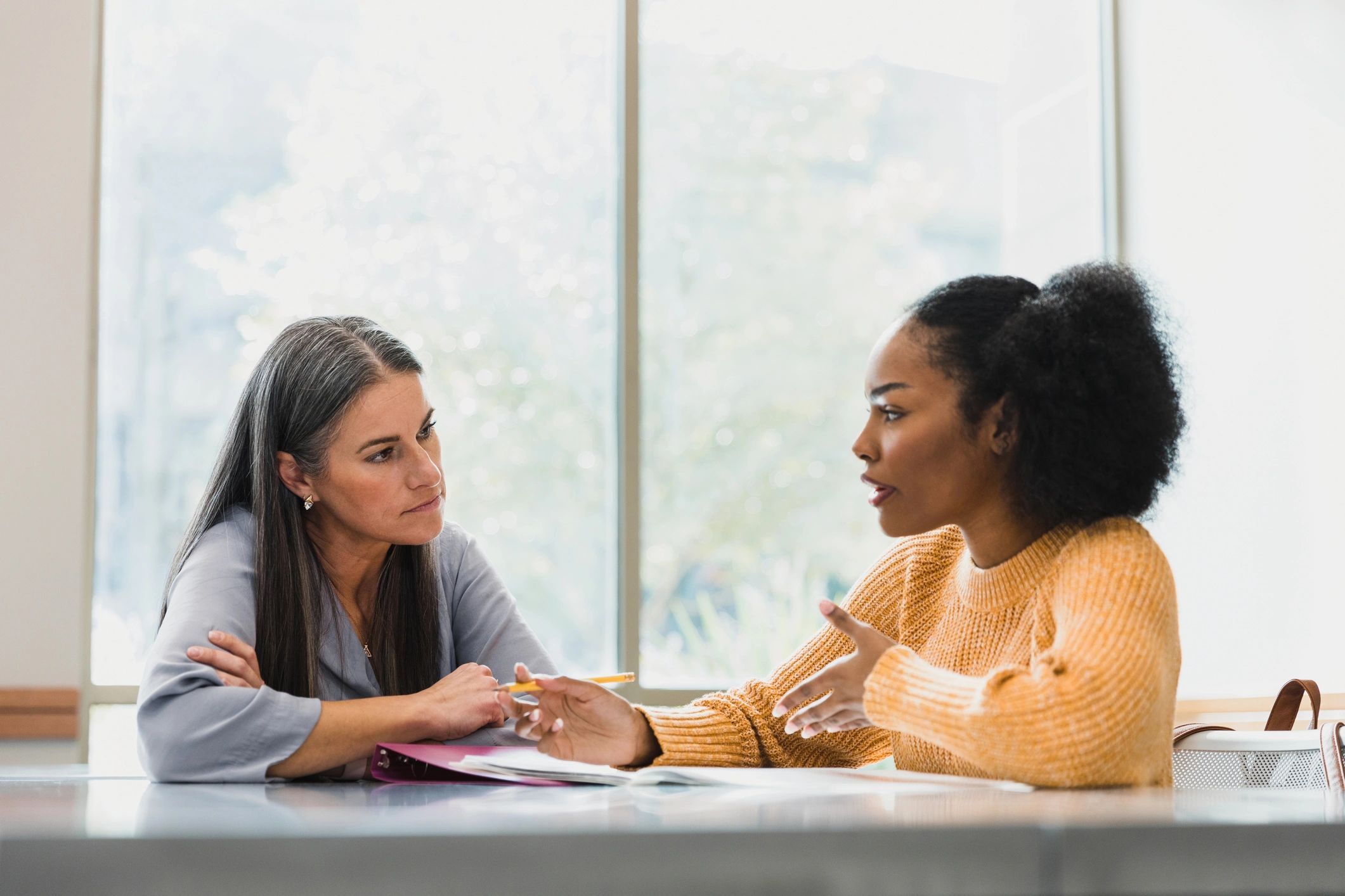 Student receiving one-to-one academic guidance