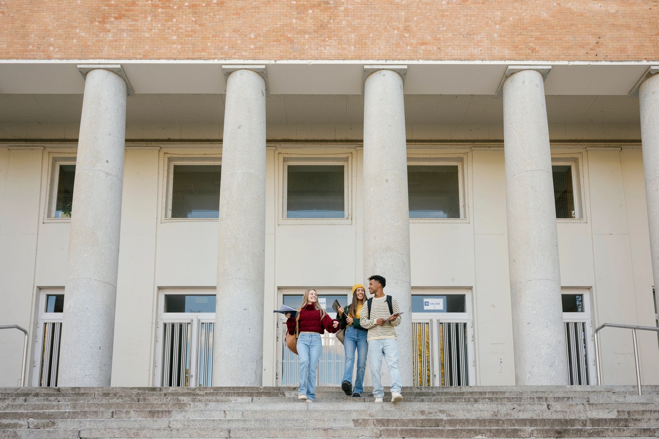 University students walking down campus stairs
