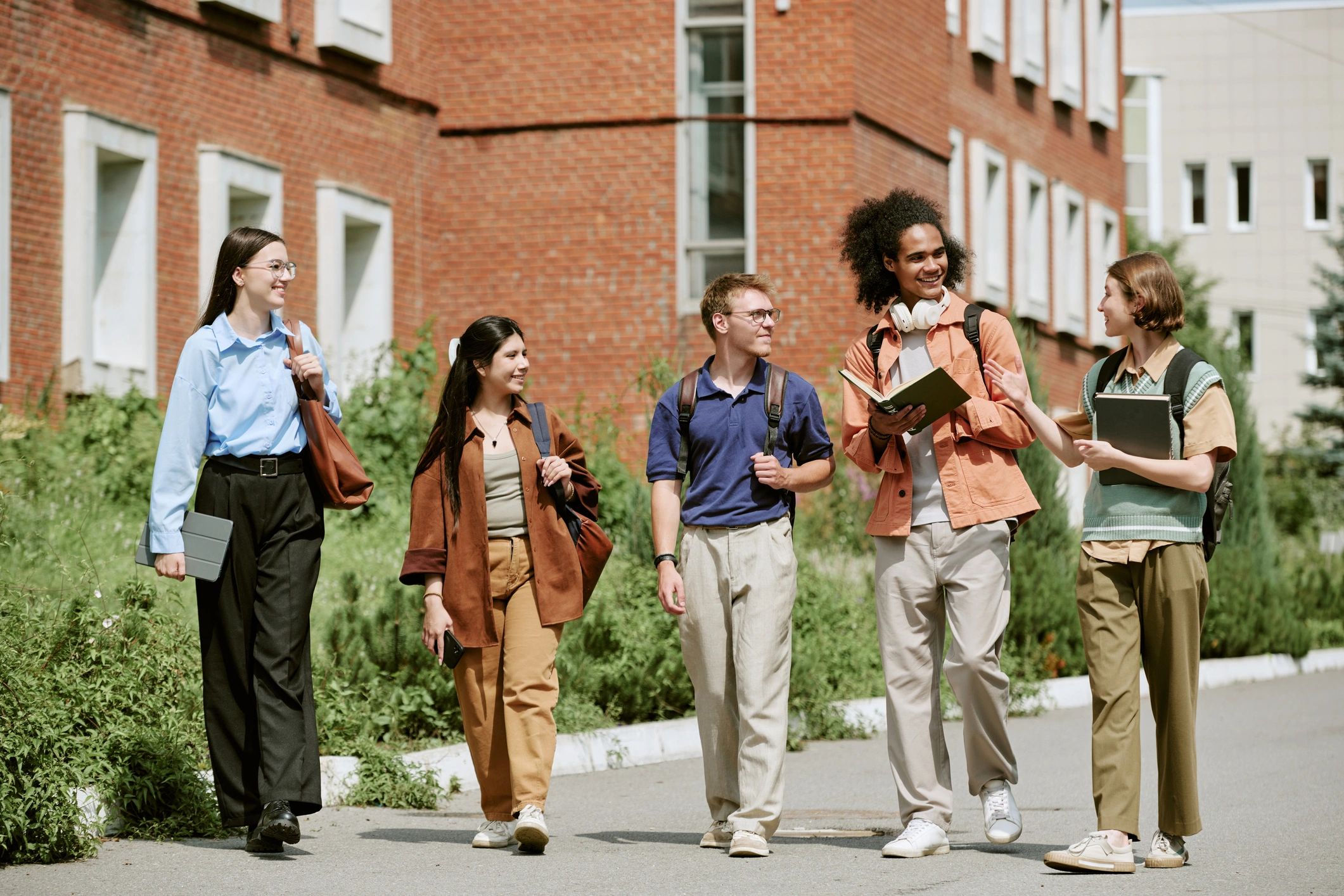 Students discussing coursework on campus